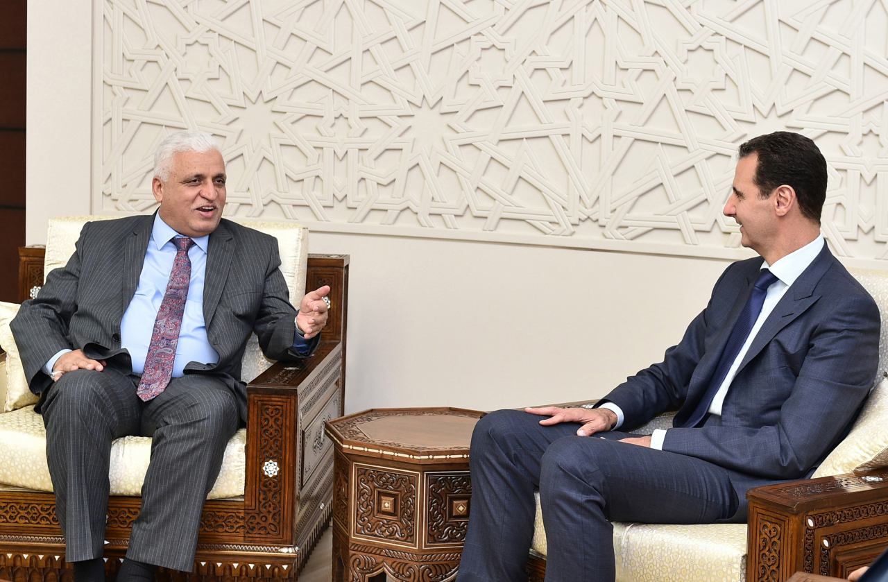 National Security Adviser in the Iraqi government and President of Popular Mobilization Forces, Faleh al-Fayyad (L), Syrian President Bashar al-Assad (R)