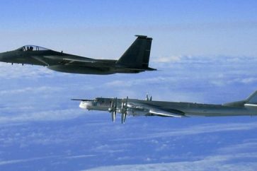 Illustrative photo of an American F-15 intercepting a Russian Tu-95 Bear Bomber during a Russian exercise near the west coast of Alaska in 2008. (US Air Force/Wikimedia Commons)