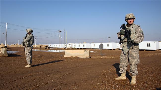 US soldiers walking around at a military base which hosts US troops north of the Iraqi capital Baghdad (photo from 2014)