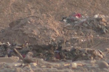 A mass grave containing the remains of about 100 beheaded civilians has been discovered inside a school in a town south of Mosul.