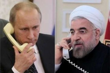 Iranian President Sheikh Hassan Rouhani (R) and his Russian counterpart Vladimir Putin (L)