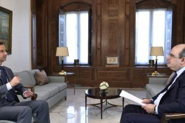 President Bashar al-Assad during interview with Syrian daily al-Watan