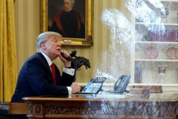 US President Donald Trump waits to speak by phone with the Saudi Arabia's King Salman in the Oval Office at the White House in Washington, U.S. January 29, 2017. REUTERS/Jonathan Ernst