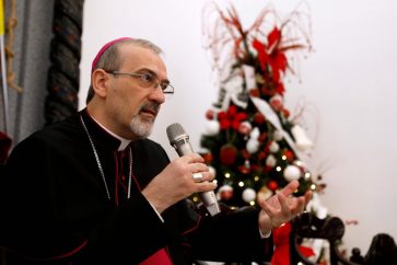 Archbishop Pierbattista Pizzaballa, Apostolic Administrator of the Latin Patriarchate of Jerusalem, speaks during the annual pre-Christmas press conference at the Latin Patriarchate headquarters in the old city of Jerusalem on December 20, 2017. / AFP PHOTO / GALI TIBBON