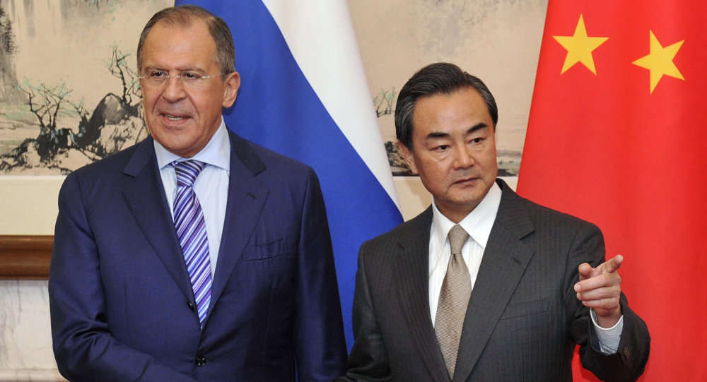 Russian Foreign Minister Sergei Lavrov and his Chinese counterpart, Wang Yi.
