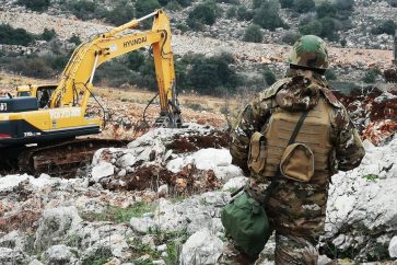 Lebanese soldier guarding Lebanon's border in face of Zionist bulldozer