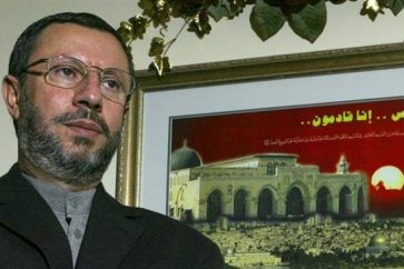 This file picture shows a former Palestinian university professor and presidential candidate Abdelhalim al-Ashqar standing by a framed painting of Jerusalem al-Quds, in his home in Virginia, the United States. (Photo by Getty Images)