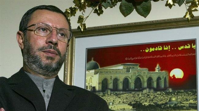 This file picture shows a former Palestinian university professor and presidential candidate Abdelhalim al-Ashqar standing by a framed painting of Jerusalem al-Quds, in his home in Virginia, the United States. (Photo by Getty Images)