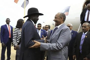 In this photo provided by the official SUNA news agency, Gen. Abdel-Fattah Burhan, center right, head of Sudan’s sovereign council, is greeted by South Sudan’s President Salva Kiir, center left, in Juba, South Sudan, Monday, Oct. 14, 2019. Sudan's new transitional government is starting talks Monday with rebel leaders in South Sudan's capital, Juba to kick off peace talks aimed at ending the country's yearslong civil wars. Achieving peace is crucial to the transitional government in Sudan. It has counted on ending the wars with rebels in order to revive the country's battered economy through slashing the military spending, which takes up much of the national budget. (SUNA via AP)