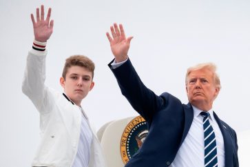 US President Donald Trump and his son Barron wave as they board Air Force One at Morristown Municipal Airport in Morristown, New Jersey, on August 16, 2020. (Photo by JIM WATSON / AFP) (Photo by JIM WATSON/AFP via Getty Images)