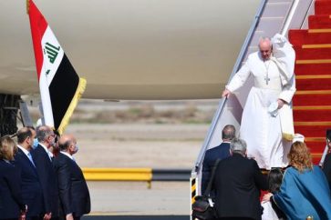 Pope Francis arrives at Baghdad airprot on March 5, 2021 on the first papal visit to Iraq. - Pope Francis began his historic trip to war-scarred Iraq, defying security concerns and the coronavirus pandemic to comfort one of the world's oldest and most persecuted Christian communities. (Photo by Vincenzo PINTO / AFP) (Photo by VINCENZO PINTO/AFP via Getty Images)