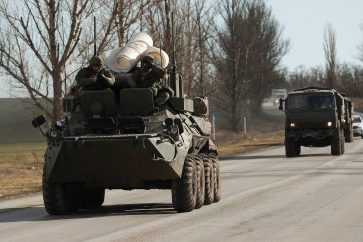 ROSTOV-ON-DON REGION, RUSSIA - FEBRUARY 19, 2022: An armoured vehicle drives by. On February 21, Russia recognized the Donetsk and Lugansk People's Republics, the friendship, cooperation and mutual assistance treaties signed with their leaders. Stringer/TASSÐîññèÿ. Ðîñòîâñêàÿ îáëàñòü. Âîåííàÿ òåõíèêà íà äîðîãå. Ïðåçèäåíò Ðîññèè Âëàäèìèð Ïóòèí 21 ôåâðàëÿ çàÿâèë î ïðèçíàíèè ñóâåðåíèòåòà Äîíåöêîé è Ëóãàíñêîé íàðîäíûõ ðåñïóáëèê, ñ èõ ëèäåðàìè áûëè ïîäïèñàíû äîãîâîðû î äðóæáå, ñîòðóäíè÷åñòâå è âçàèìíîé ïîìîùè. Ñòðèíãåð/ÒÀÑÑ