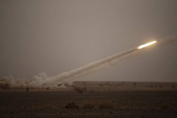 A launch truck fires the High Mobility Artillery Rocket System (HIMARS) at its intended target during the African Lion military exercise in Grier Labouihi complex, southern Morocco, Wednesday, June 9, 2021. With more than 7,000 participants from nine nations and NATO, African Lion is U.S. Africa Command's largest exercise. (AP Photo/Mosa'ab Elshamy)