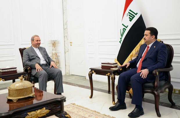 Iraqi Prime Minister Mohammed Shia Al-Sudan hosting Iranian ambassador to Baghdad Mohammad Kazem Al-e Sadegh
