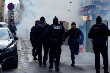 Protestors clash with French police during a demonstration near the Rue d'Enghien after gunshots were fired killing and injuring several people in a central district of Paris, France, December 23, 2022. REUTERS/Sarah Meyssonnier