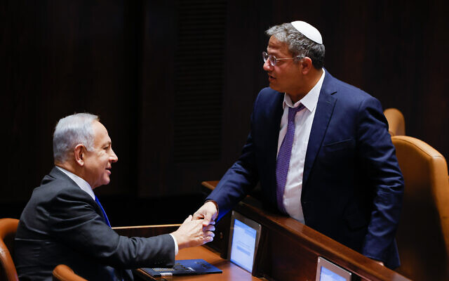 Likud leader MK Benjamin Netanyahu with Head of the Otzma Yehudit party MK Itamar Ben Gvir at a vote in the assembly hall of the Knesset, the Israeli parliament in Jerusalem, on December 28, 2022. 