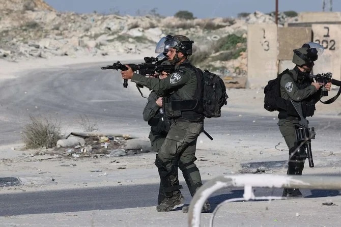 Israeli occupation forces  in the West Bank town of Al-Ram (January 27, 2023).