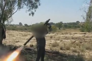 Al-Qassam Brigades fighter firing surface-to-air missile at Zionist warplane flying over Gaza