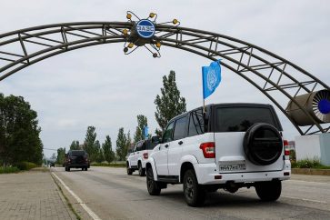 A motorcade transporting members of the International Atomic Energy Agency (IAEA) expert mission, escorted by the Russian military, drives towards the Zaporizhzhia Nuclear Power Plant. August 4, 2023