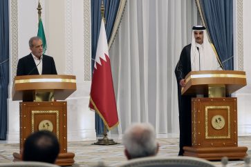 Iran's President Masoud Pezeshkian (L) gives a joint press conference with Qatar's Emir Sheikh Tamim bin Hamad al-Thani, in Doha on October 2, 2024. (Photo by Karim JAAFAR / AFP)