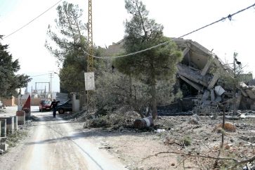 A destroyed building stands next to an abandoned Lebanese army checkpoint in the aftermath of an overnight Israeli airstrike that targeted Baalbeks al-Charawneh neighborhoud in Lebanon's eastern Bekaa valley on November 2, 2024. Lebanon's health ministry said that 52 people were killed and 72 wounded in Israeli strikes on November 1, in the country's eastern Baalbek-Hermel region, attacks for which the Israeli army had not issued evacuation warnings. (Photo by AFP)