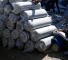 A boy sits as Palestinians gather to receive aid provided by UNRWA including food supplies