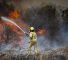 Firefighter trying to extinguish a fire in occupied Al-Quds
