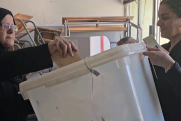 Voter casting ballot